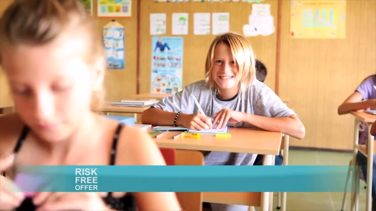 A kid focused at his classroom desk